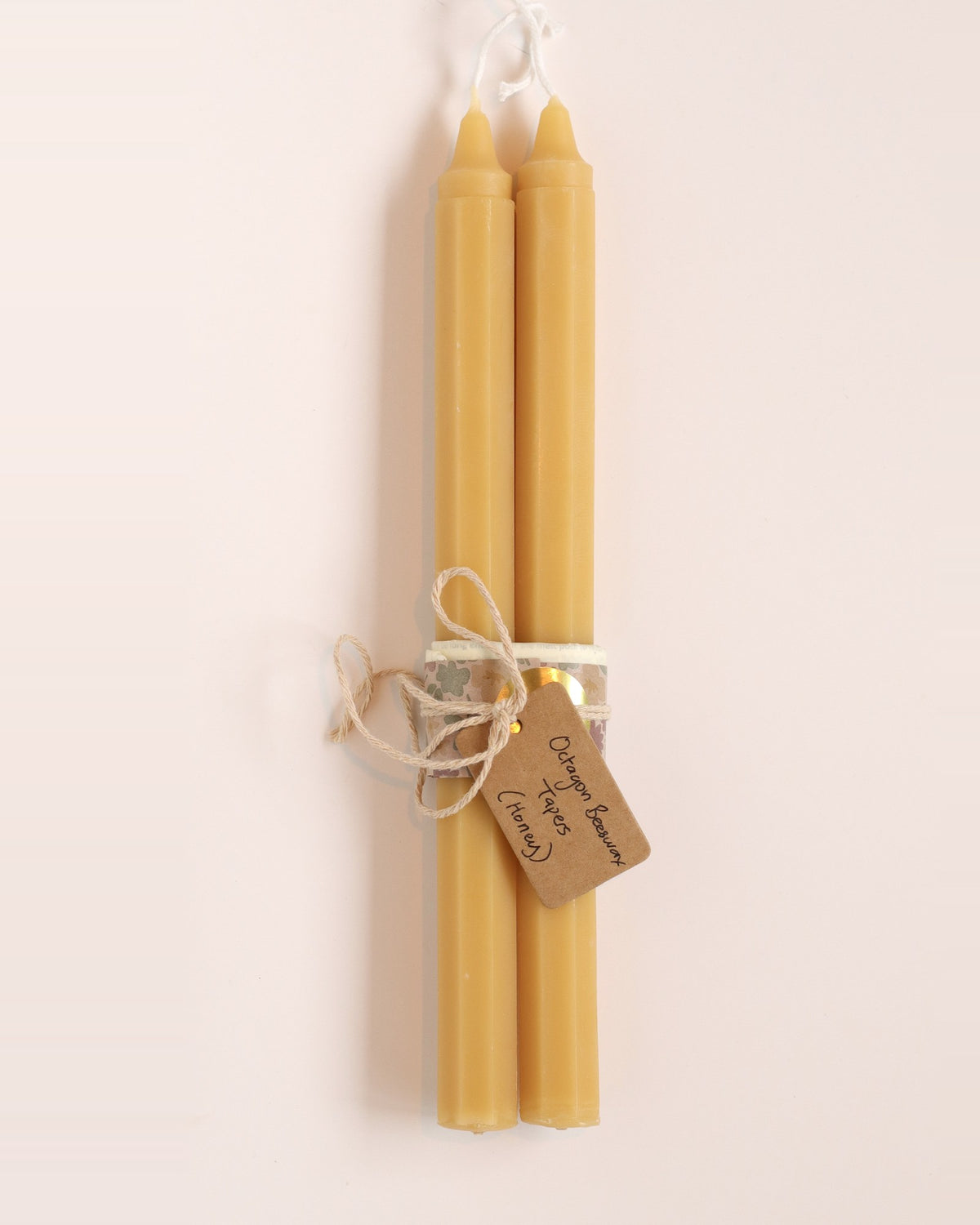 Elliot's Treasures Octagon Taper Beeswax Candle Pair in Honey, tied with twine and a kraft tag