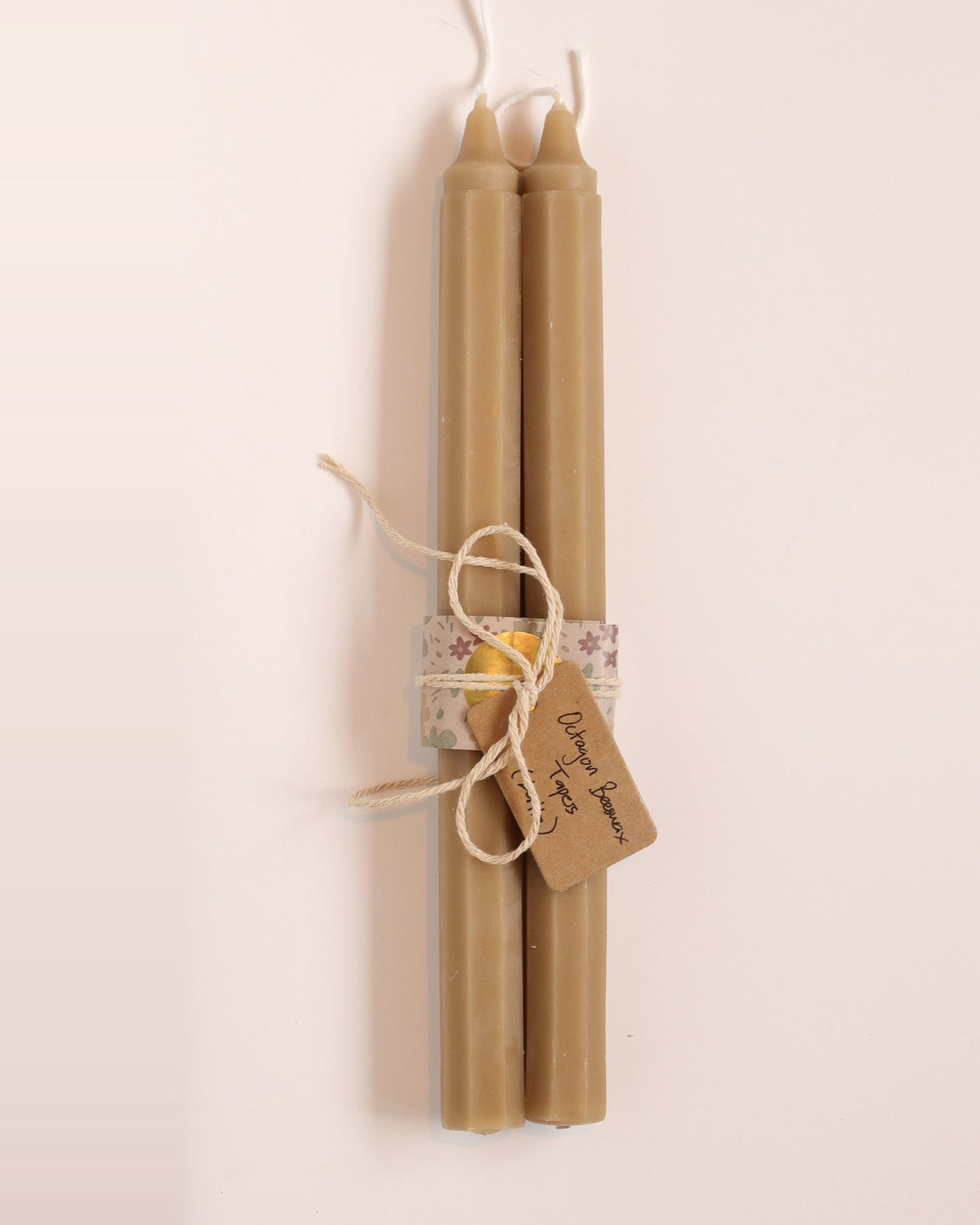 Elliot's Treasures Octagon Taper Beeswax Candle Pair in Latte, tied with twine and a kraft tag
