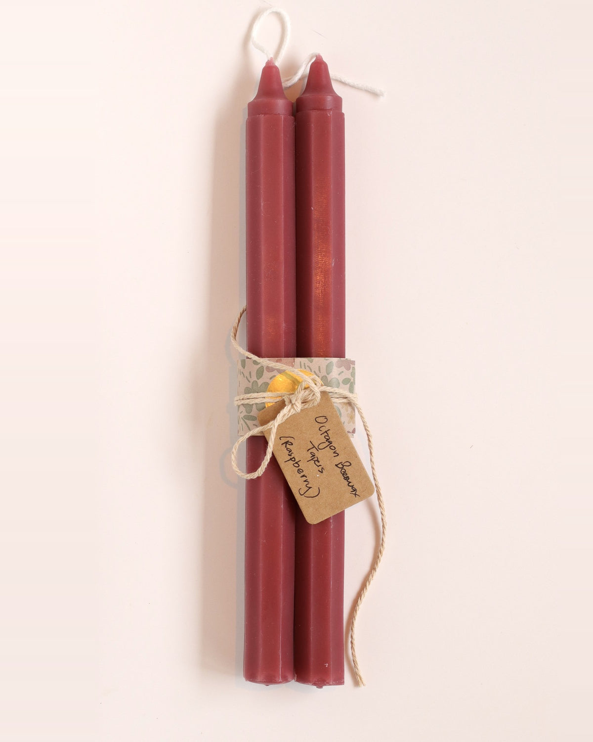 Elliot's Treasures Octagon Taper Beeswax Candle Pair in Raspberry, tied with twine and a kraft tag