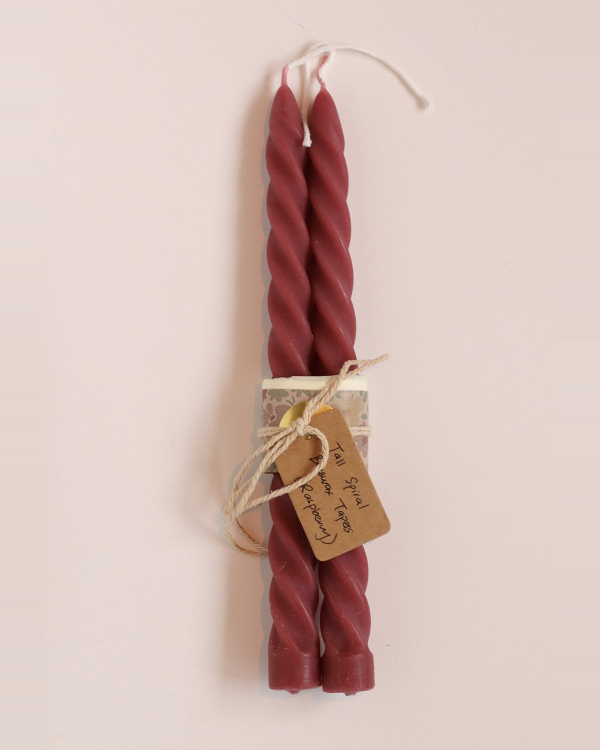 Elliot's Treasures Spiral Beeswax Candle Pair in Raspberry, tied with twine and a kraft tag