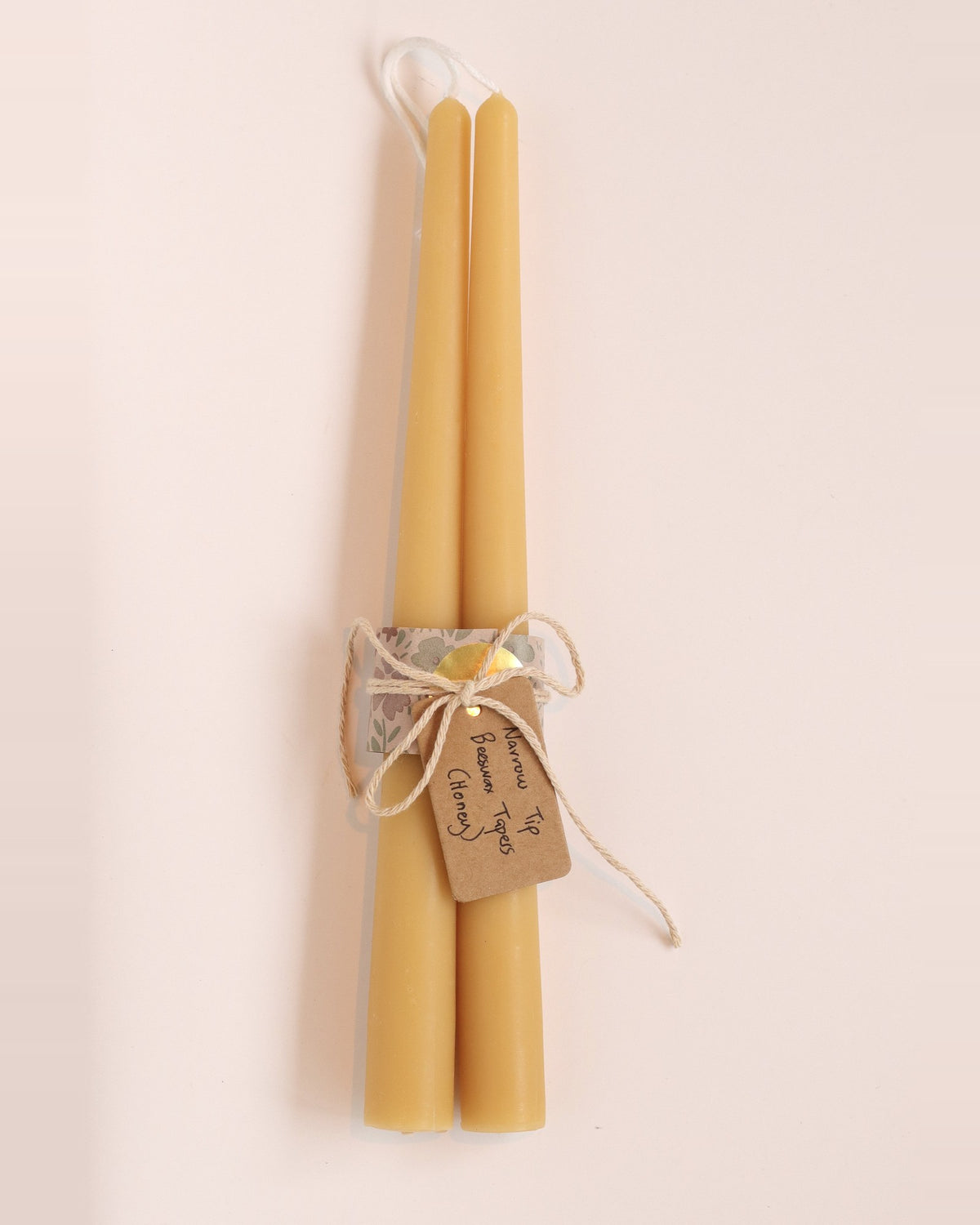 Elliot's Treasures Taper Beeswax Candle Pair in Honey, tied with twine and a kraft tag