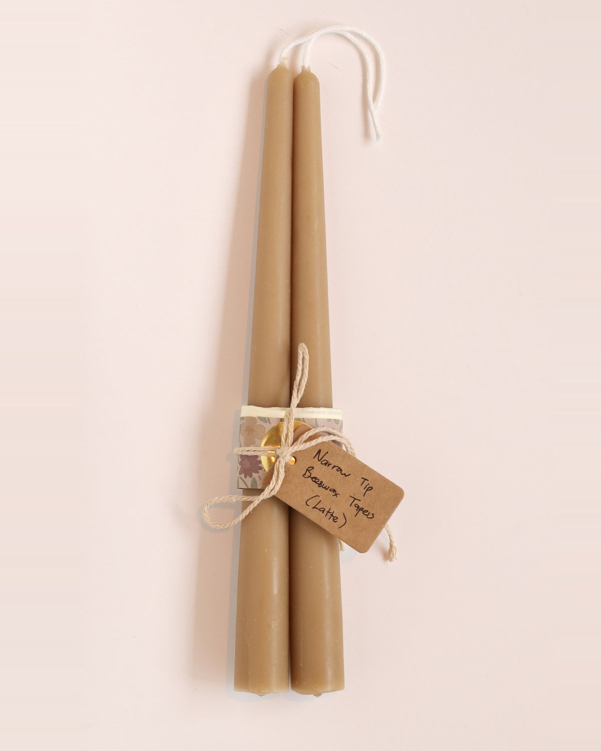 Elliot's Treasures Taper Beeswax Candle Pair in Latte, tied with twine and a kraft tag