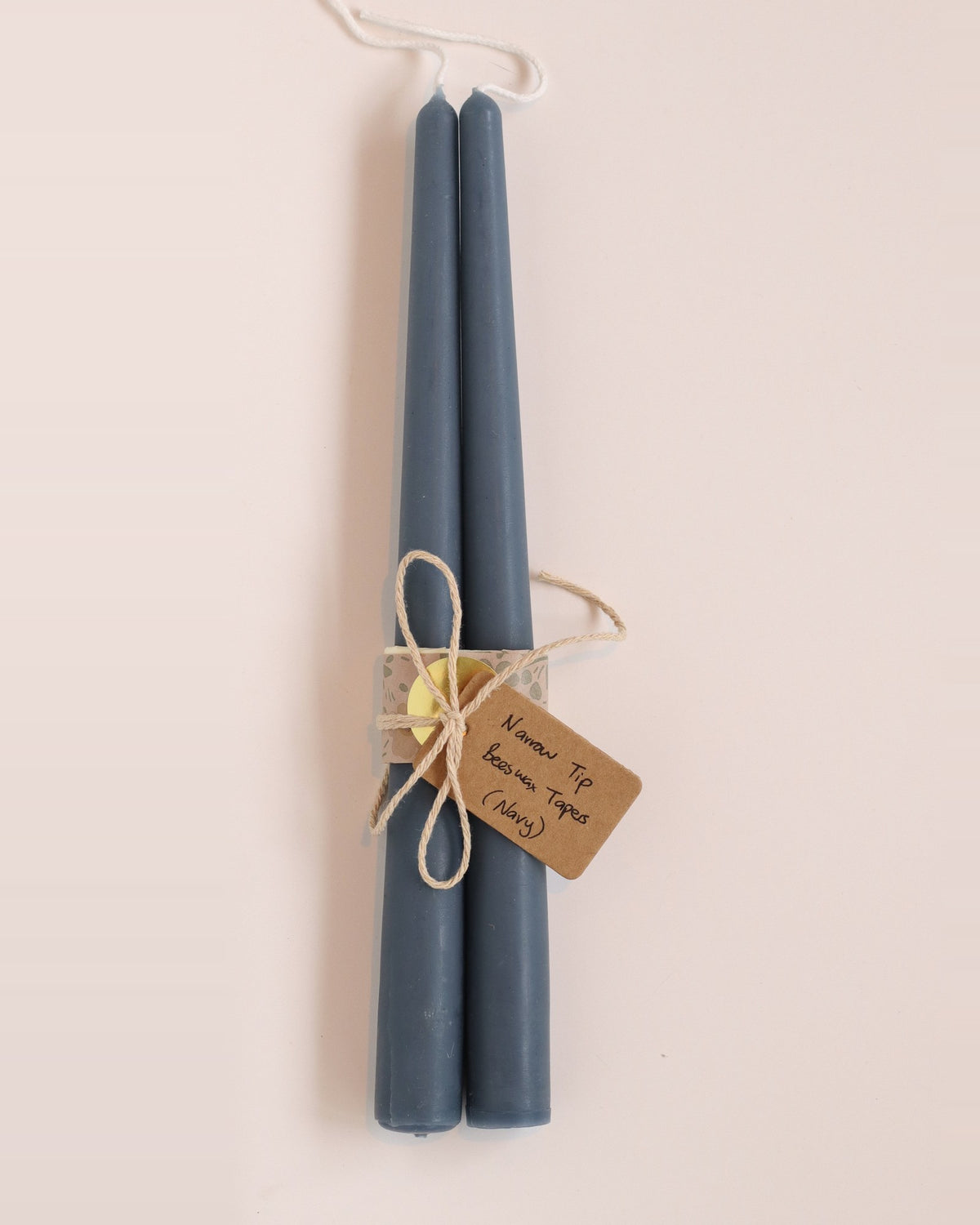 Elliot's Treasures Taper Beeswax Candle Pair in Navy, tied with twine and a kraft tag