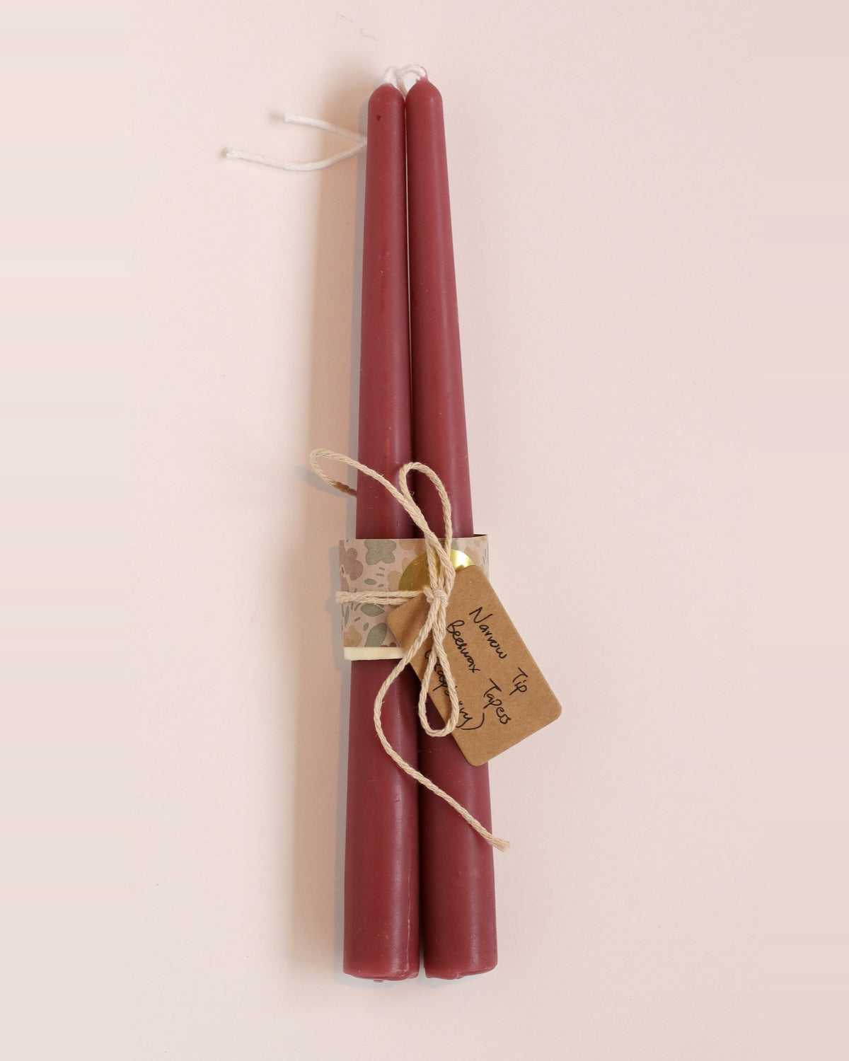 Elliot's Treasures Taper Beeswax Candle Pair in Raspberry, tied with twine and a kraft tag